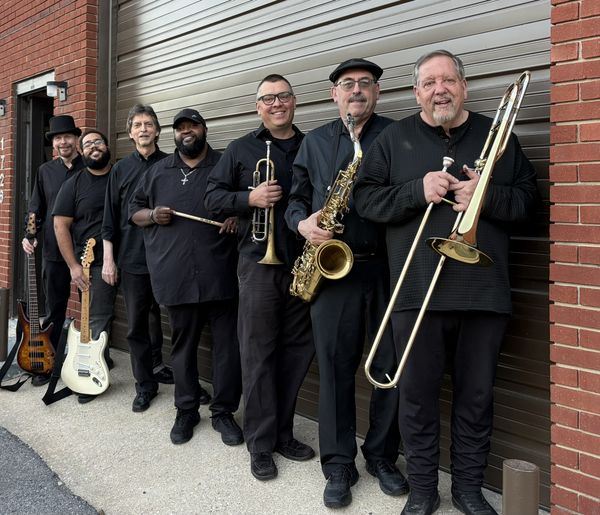 The Domino Band — full lineup outside the rehearsal space